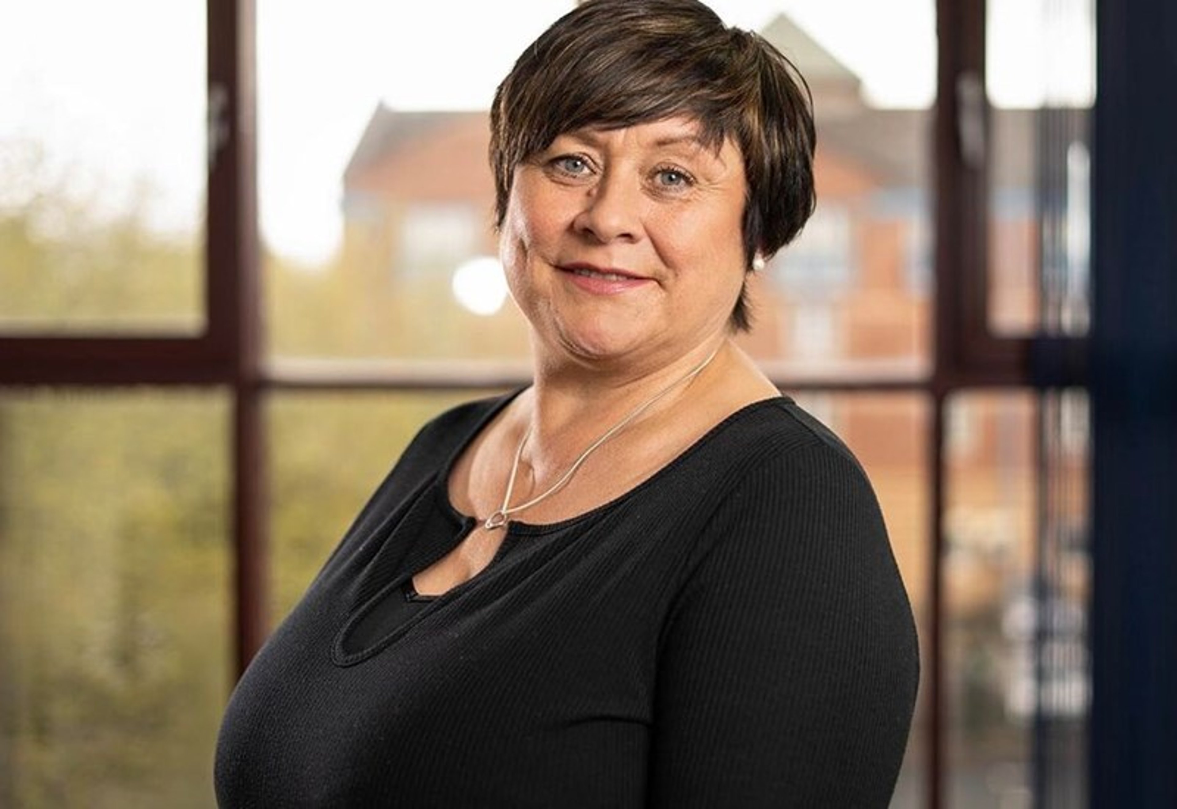 A headshot of Helen Tinsley