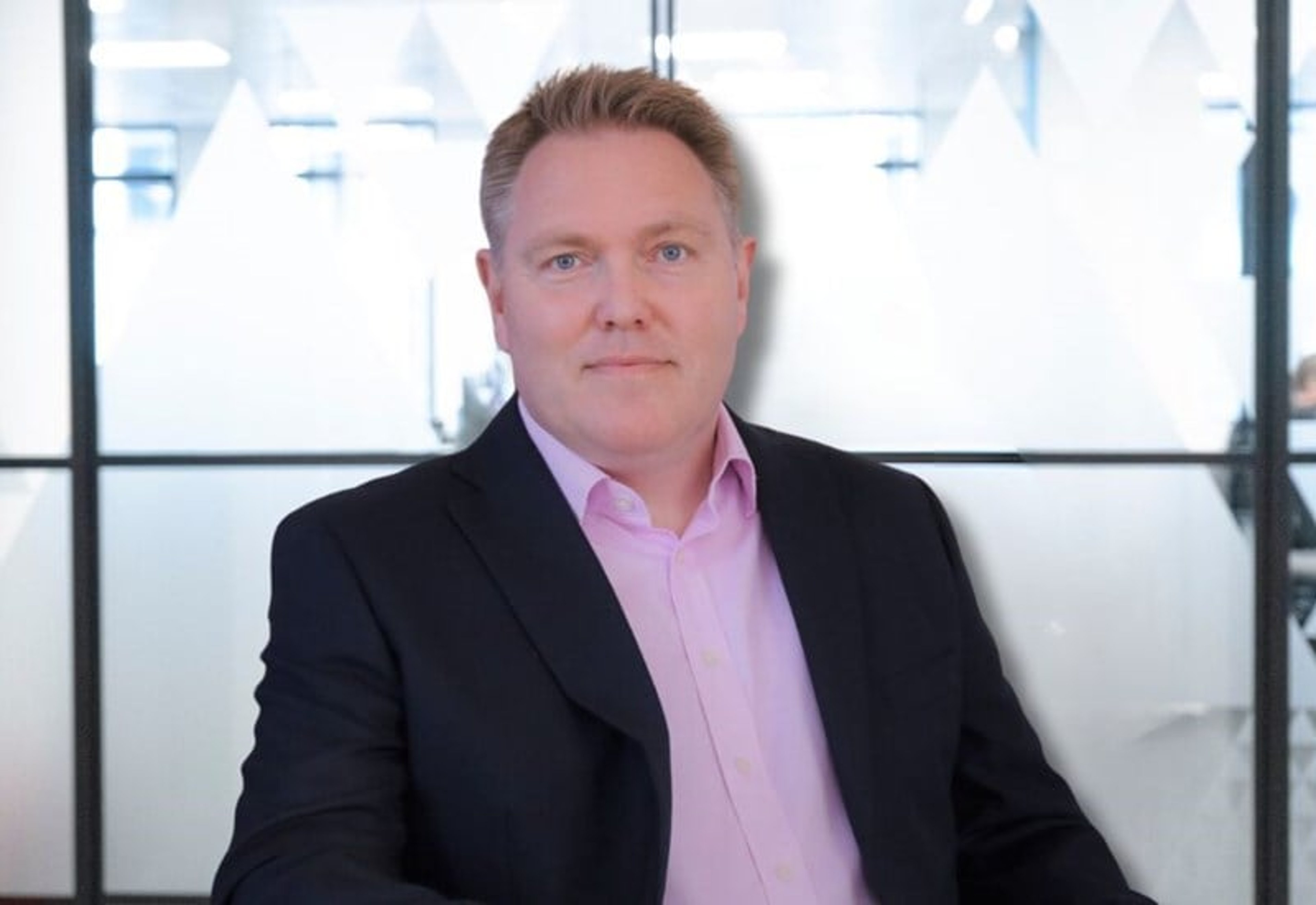 A headshot of James Thomas